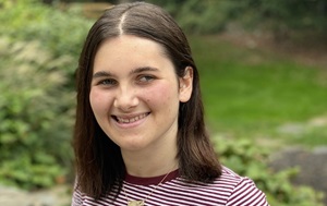 Girl smiling while standing outside