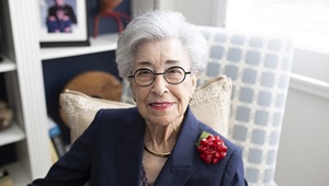 Woman sitting in a chair inside