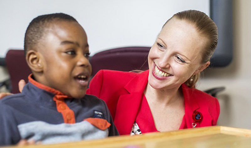 A child in our behavioral health clinic interacts with a caretaker