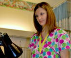 Image of RN working in an exam room