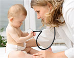 Nursing careers image of baby holding the doctors stethoscope during an appointment