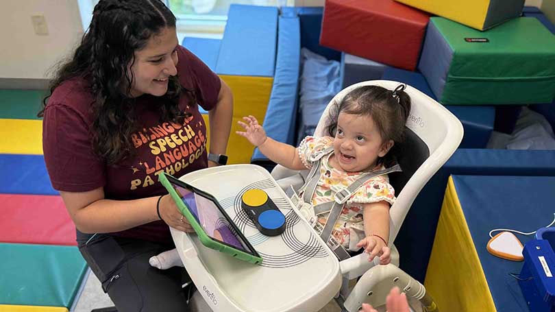 MWPH Speech Language Pathologist Cecilia Jimenez and patient Adiely Sagastume Garcia use one of MWPH's new devices during a session.